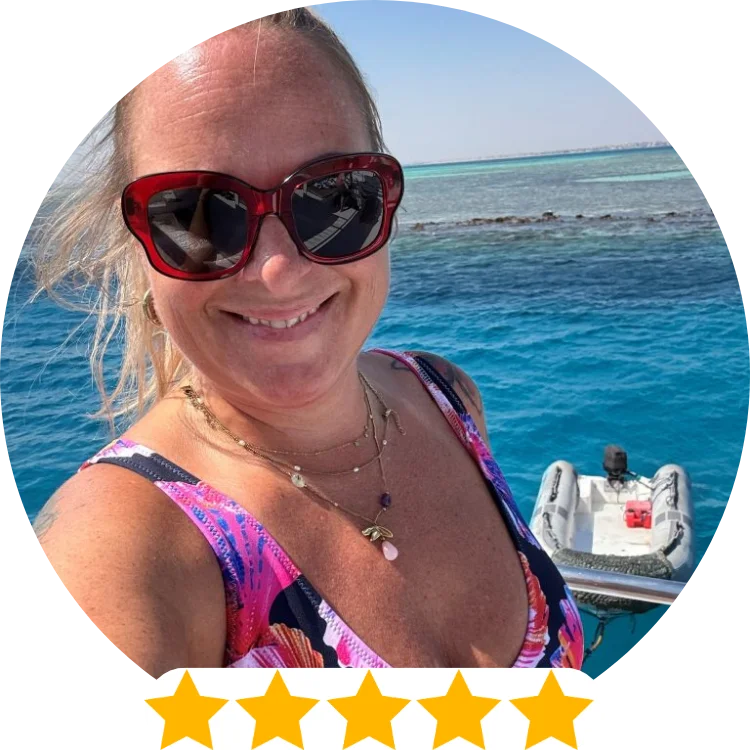 5 star review scuba bikini by The Dive Compass, woman wears pink shell bikini on a boat, swimsuits for scuba diving